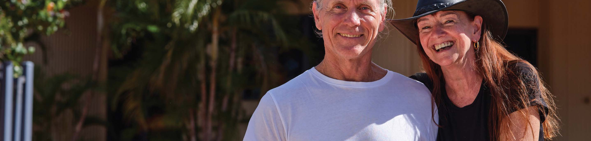 Regional WA couple smiling and waving